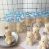 Mini Teddy Bear Candle in Gift Box with Personalized Label and Ribbon – a charming teddy bear-shaped candle, individually packaged with custom label and ribbon. Perfect for baby showers, gender reveals, and newborn celebrations, bringing warmth and a personal touch to any baby-themed event