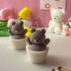Set of handcrafted Muffin Teddy Bear Candles made from natural soy wax, designed in cupcake holders in white and brown. Cute decorative bear-shaped candles ideal for home décor, nursery styling, birthday gifts, anniversaries, baby showers, or special occasions. Handmade in the UK, these kawaii aesthetic candles add a cozy, unique, and charming touch to any space.