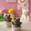 Set of handcrafted Muffin Teddy Bear Candles made from natural soy wax, designed in cupcake holders in white and brown. Cute decorative bear-shaped candles ideal for home décor, nursery styling, birthday gifts, anniversaries, baby showers, or special occasions. Handmade in the UK, these kawaii aesthetic candles add a cozy, unique, and charming touch to any space.
