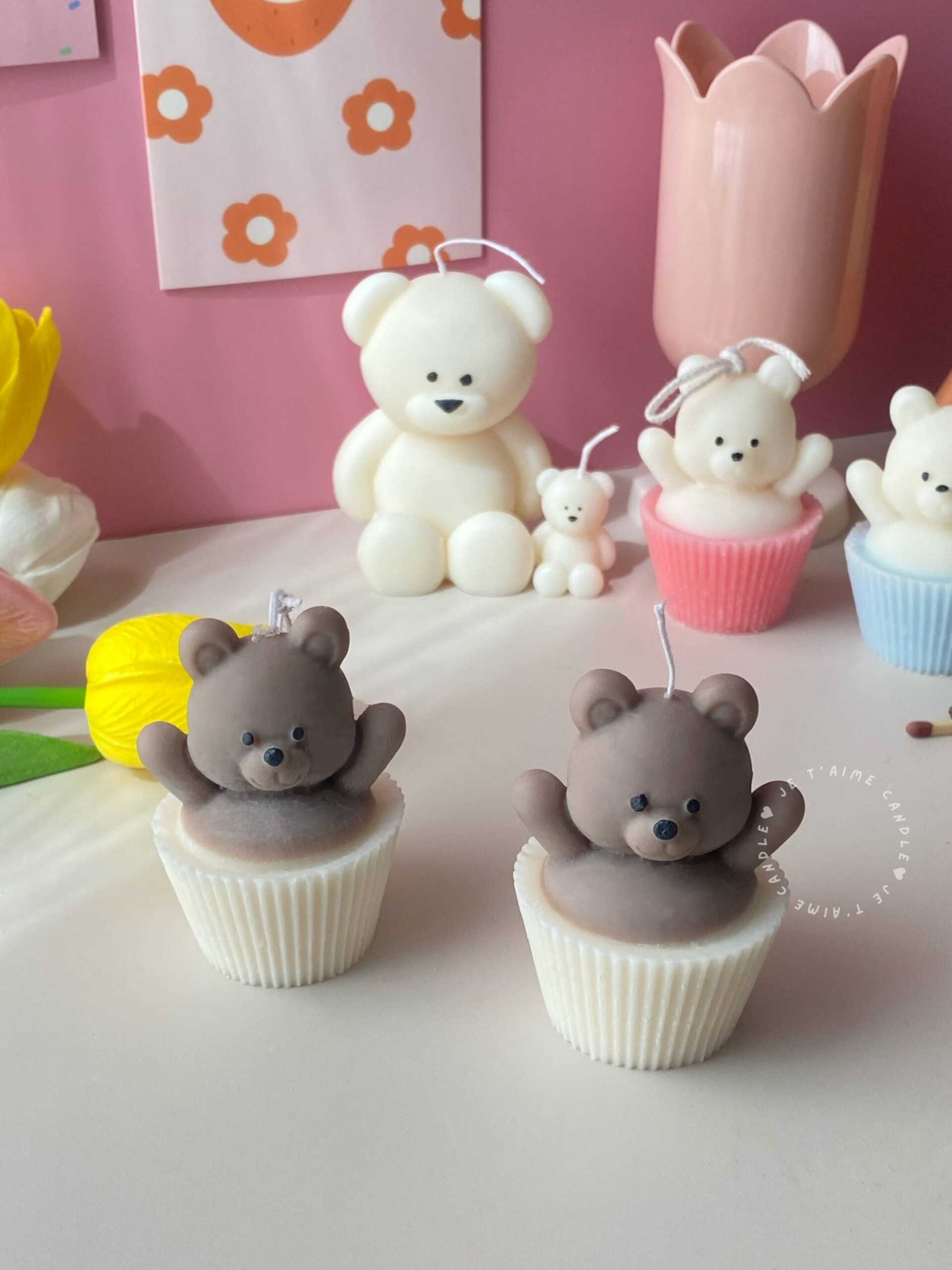Set of handcrafted Muffin Teddy Bear Candles made from natural soy wax, designed in cupcake holders in white and brown. Cute decorative bear-shaped candles ideal for home décor, nursery styling, birthday gifts, anniversaries, baby showers, or special occasions. Handmade in the UK, these kawaii aesthetic candles add a cozy, unique, and charming touch to any space.