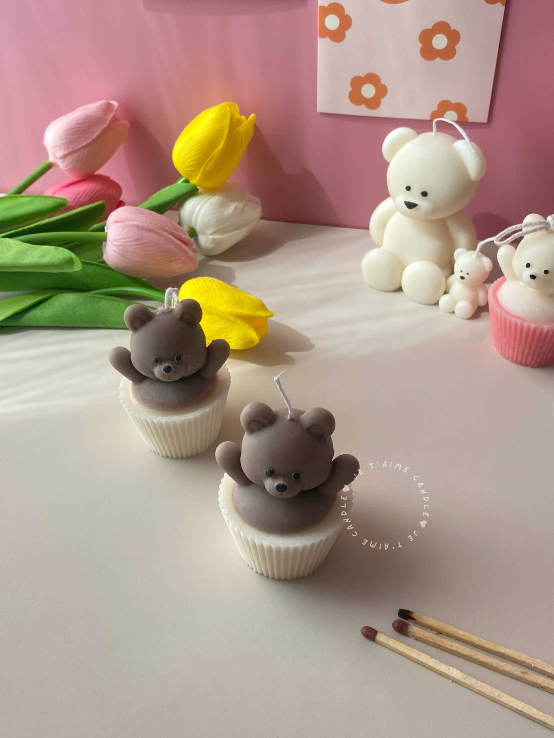 Set of handcrafted Muffin Teddy Bear Candles made from natural soy wax, designed in cupcake holders in white and brown. Cute decorative bear-shaped candles ideal for home décor, nursery styling, birthday gifts, anniversaries, baby showers, or special occasions. Handmade in the UK, these kawaii aesthetic candles add a cozy, unique, and charming touch to any space.