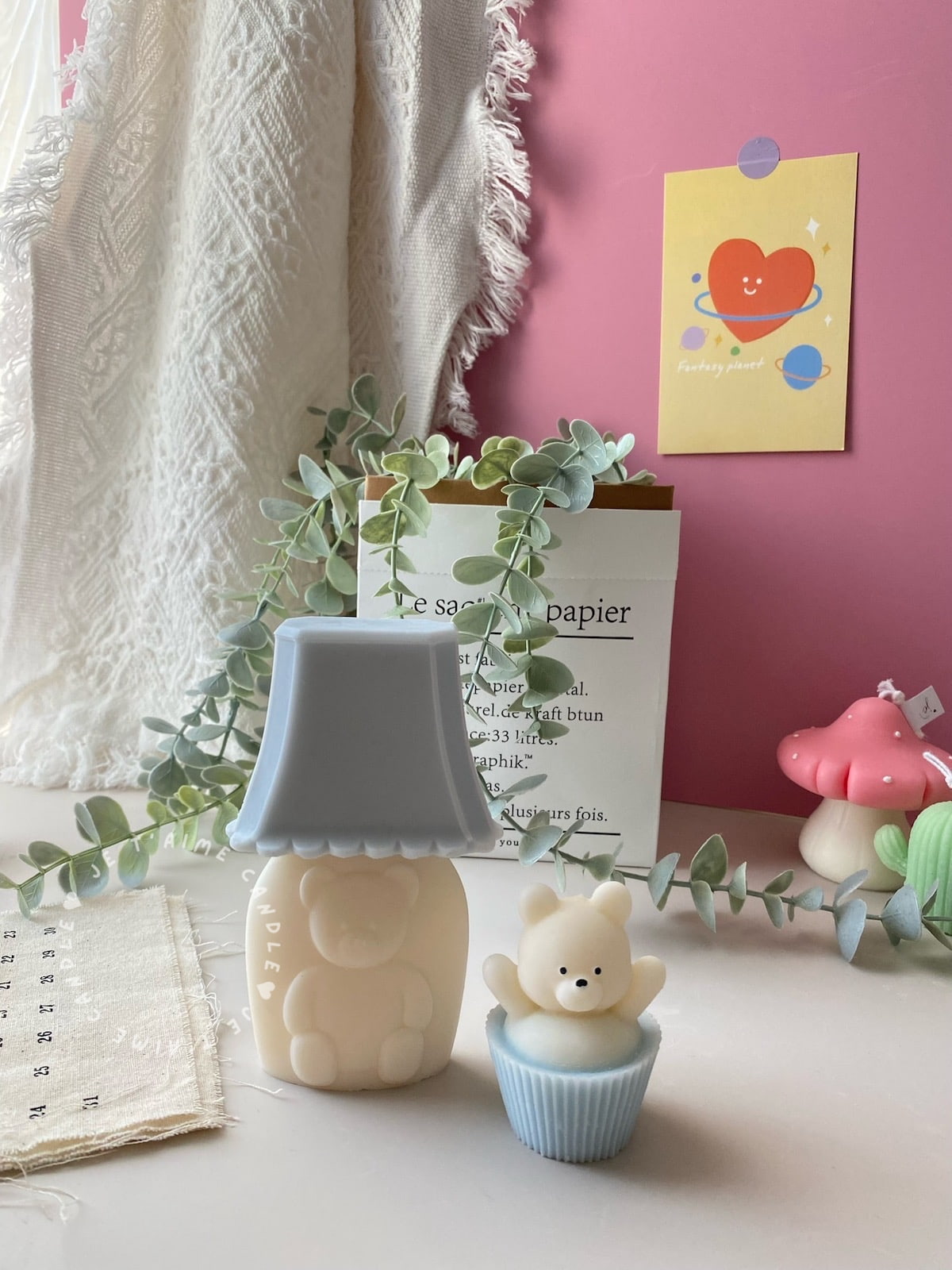 Set of handcrafted Muffin Teddy Bear Candles made from natural soy wax, designed in pastel cupcake holders in pink, purple, and brown. Cute decorative bear-shaped candles ideal for home décor, nursery styling, birthday gifts, anniversaries, baby showers, or special occasions. Handmade in the UK, these kawaii aesthetic candles add a cozy, unique, and charming touch to any space.