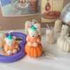 Pumpkin cute bear soy wax candle for Halloween, kawaii fall decor, and unique seasonal gift.