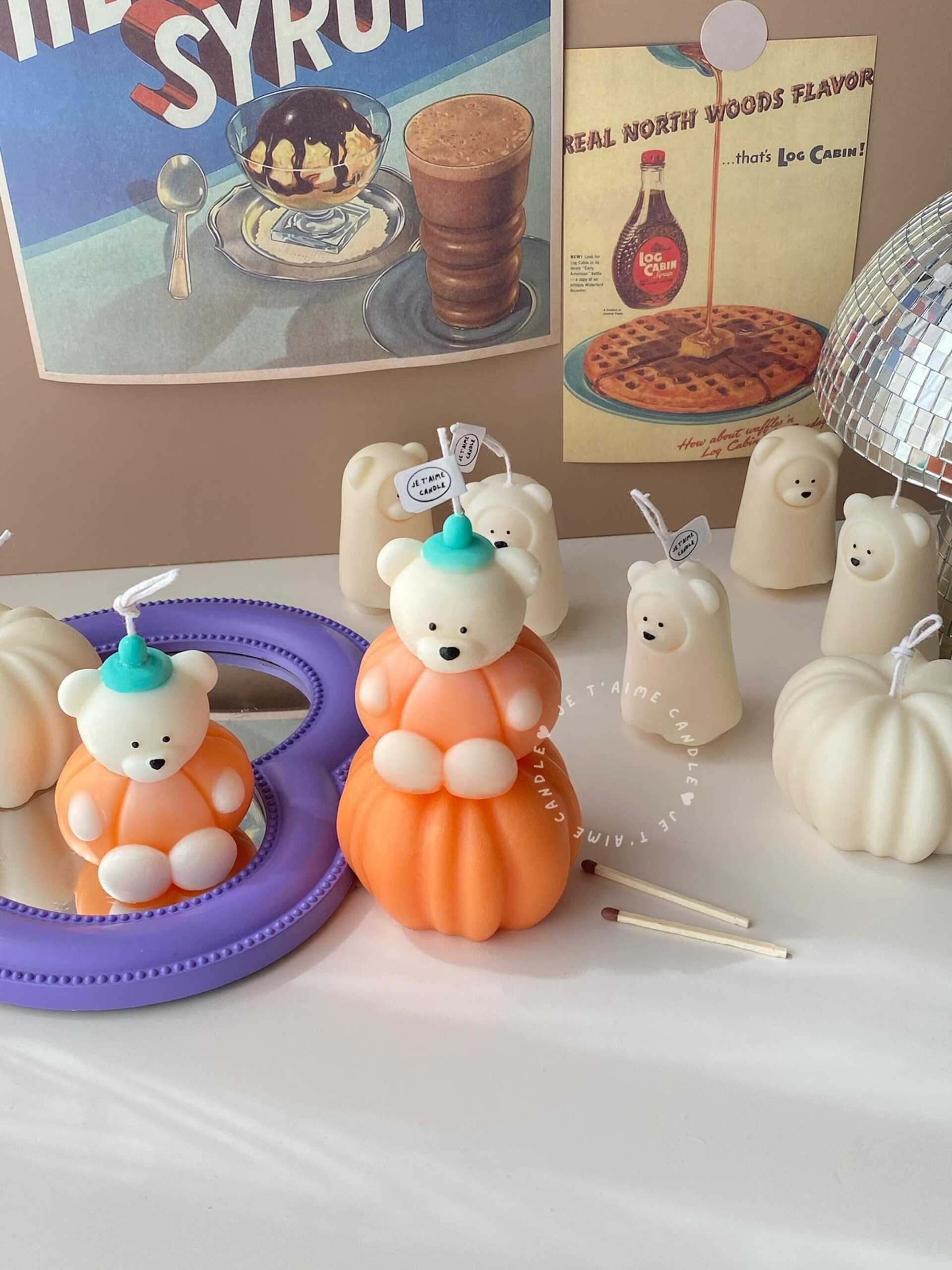 Pumpkin cute bear soy wax candle for Halloween, kawaii fall decor, and unique seasonal gift.