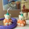 Adorable pumpkin bear candle – handmade kawaii Halloween decor.