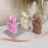 Three beautifully designed candles in white, pink and brown, perfect for a romantic gift or anniversary celebration.