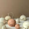 Cute chubby cat candle with rounded design, eco-friendly soy wax decor piece.