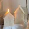 Handmade soy wax house-shaped candles in creamy white, styled with bubble cube candle and decorative accents, perfect for minimalist home décor, cozy table styling, wedding centerpieces, or unique handmade gift ideas.