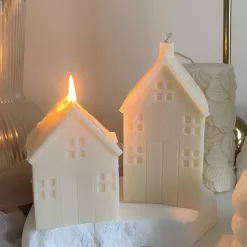 Handmade soy wax house-shaped candles in creamy white, styled with bubble cube candle and decorative accents, perfect for minimalist home décor, cozy table styling, wedding centerpieces, or unique handmade gift ideas.
