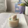 A collection of small animal candle, evoking a cozy hot spring bath atmosphere.