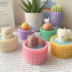 A collection of small animal candle, evoking a cozy hot spring bath atmosphere.