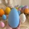 A cheerful assortment of colorful egg candles on a table, perfect for celebrating a joyful occasion.