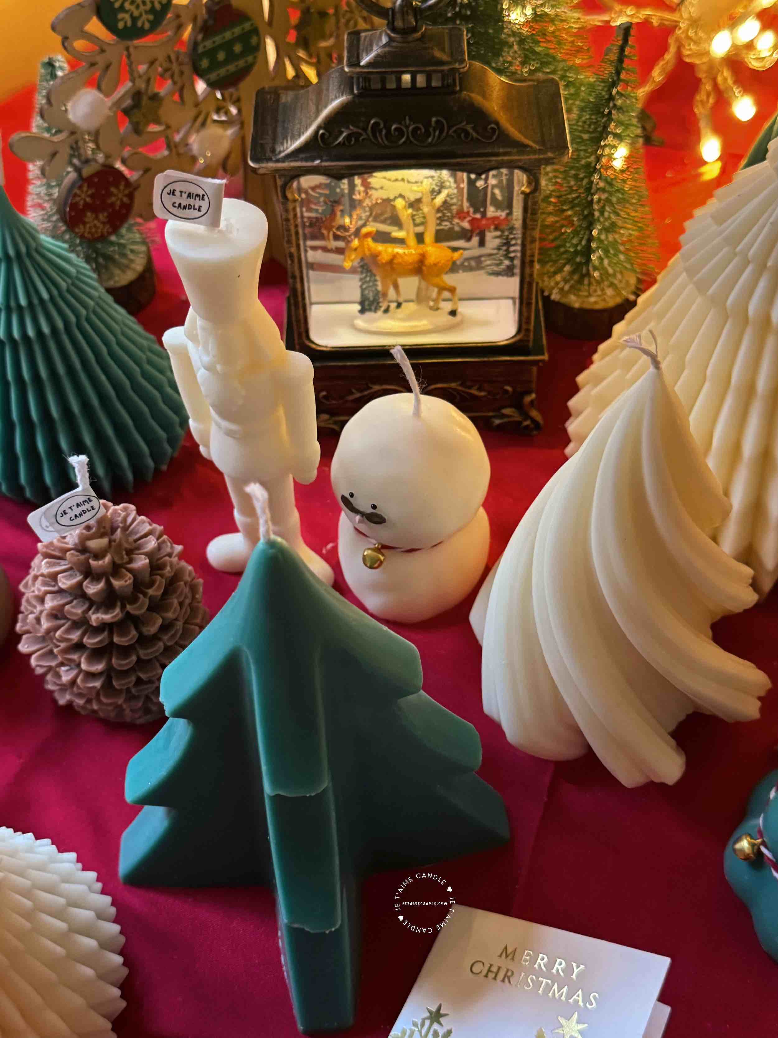 A handcrafted Abstract Christmas Tree Candle, designed to enhance holiday decor. The candle features a unique abstract design that captures the essence of the season, making it a beautiful centerpiece for a winter Christmas table. Its warm, flickering light adds a cozy ambiance, embodying the holiday spirit.