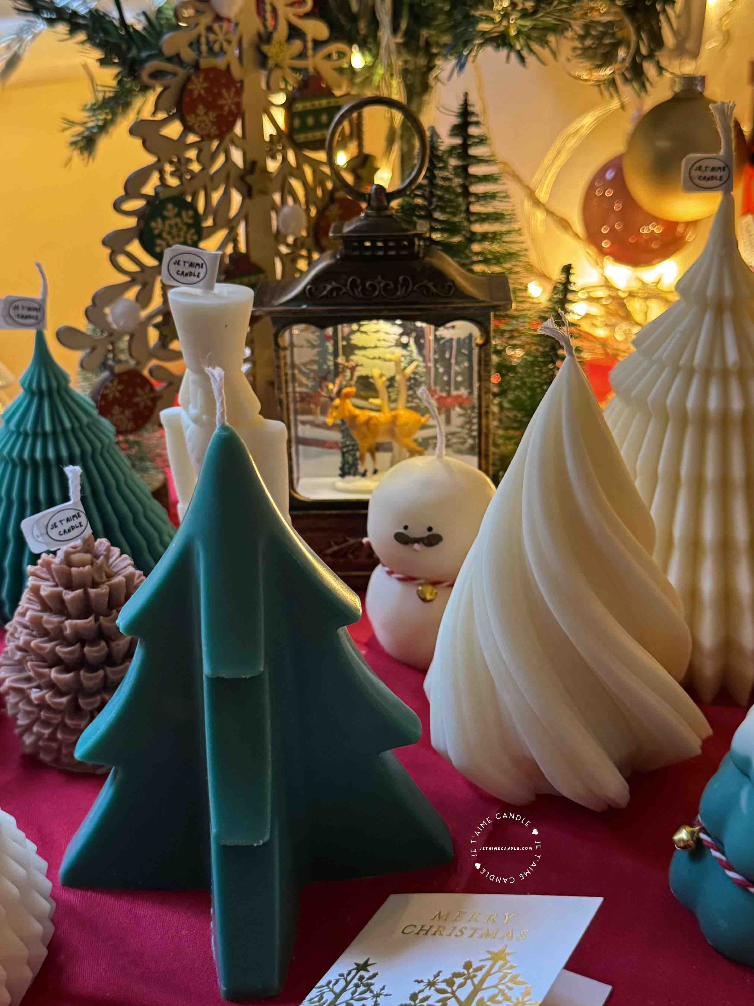 A handcrafted Abstract Christmas Tree Candle, designed to enhance holiday decor. The candle features a unique abstract design that captures the essence of the season, making it a beautiful centerpiece for a winter Christmas table. Its warm, flickering light adds a cozy ambiance, embodying the holiday spirit.
