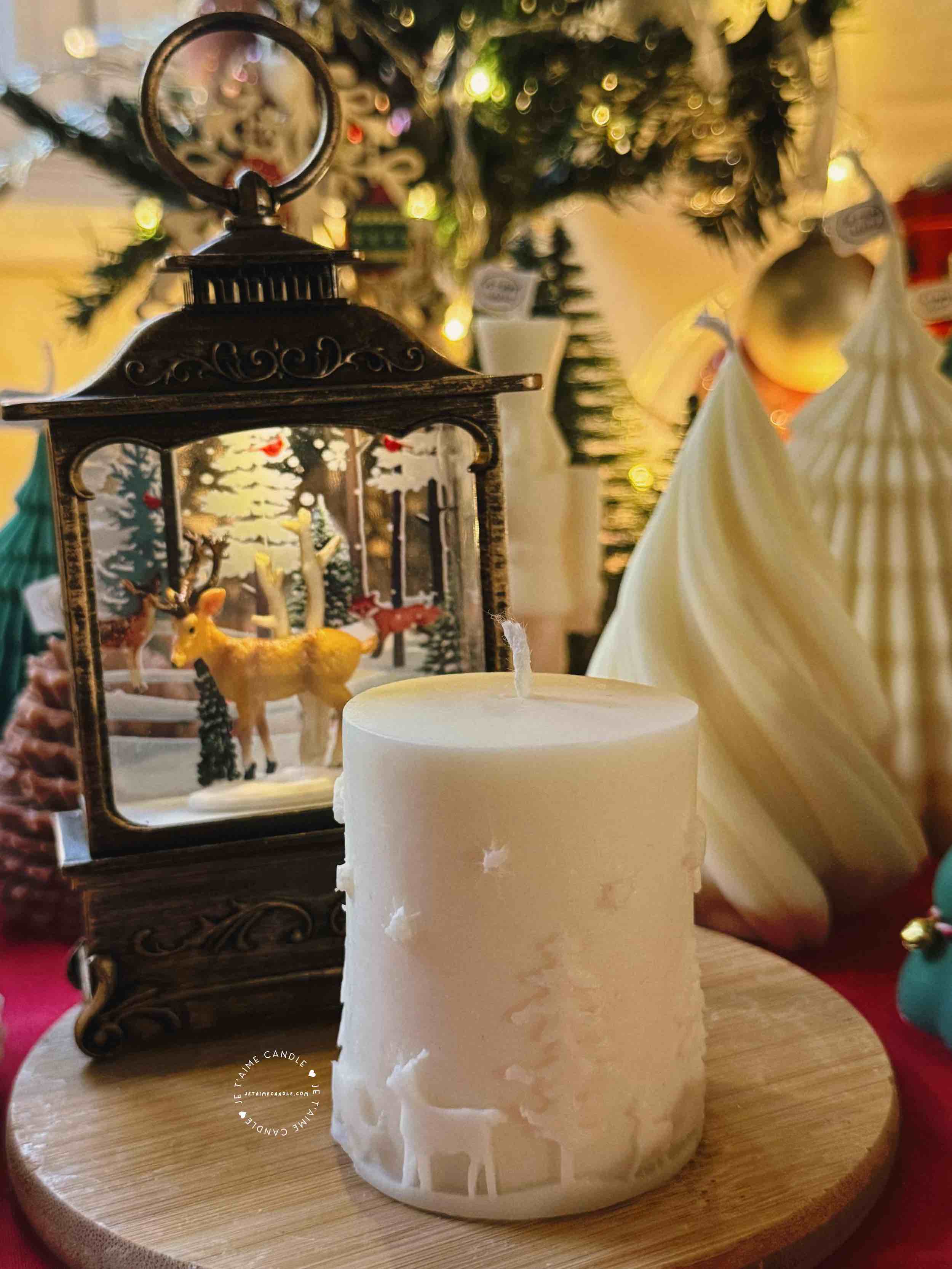 A handcrafted Christmas pillar candle featuring a beautiful deer scene, adding a touch of winter magic to your home. This elegant candle is perfect for holiday decor or as a unique gift, bringing warmth and seasonal charm to any room.