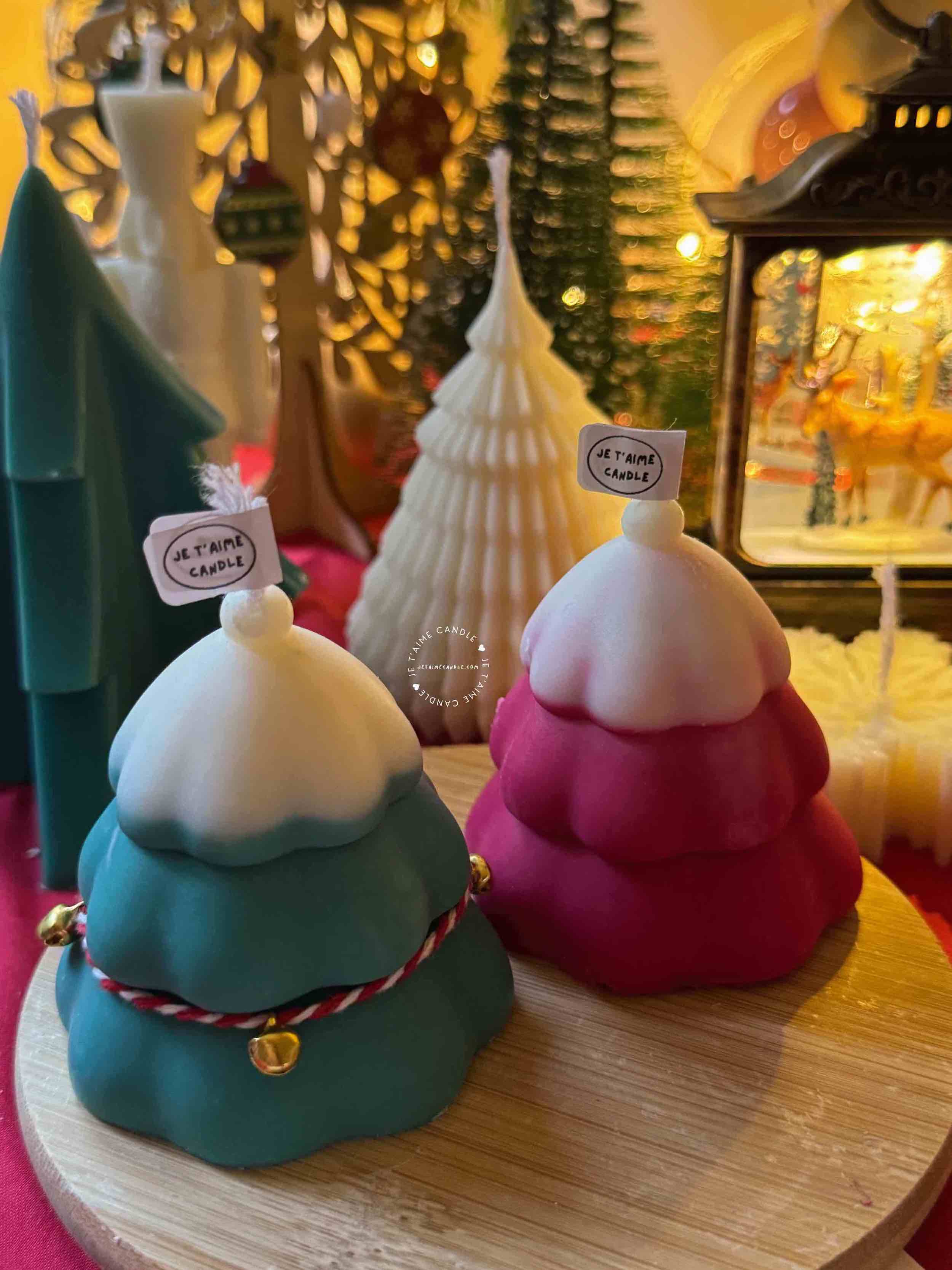 Handcrafted Christmas tree candle made from high-quality soy wax, decorated with a twine bow and small jingle bells. Perfect for holiday decor or as a gift, this festive candle adds charm to any space.