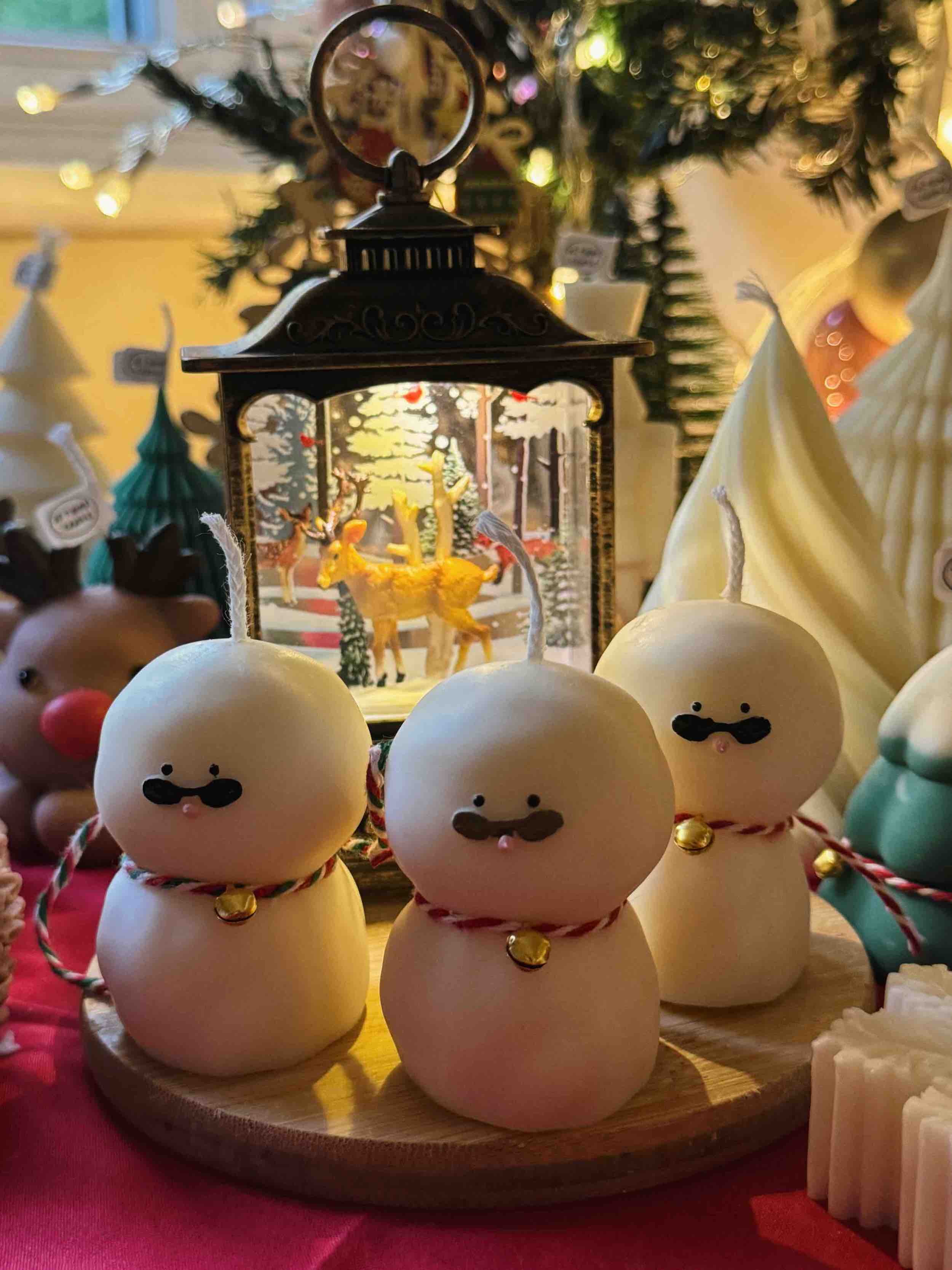 An adorable handmade snowman candles, perfect for Christmas decor or holiday gifts. Each candle features a snowman with a cute sunglasses and a holiday bell, crafted from high-quality wax for a clean burn. The charming design adds warmth and festive cheer to any room, ideal for winter themes or cozy home decor.