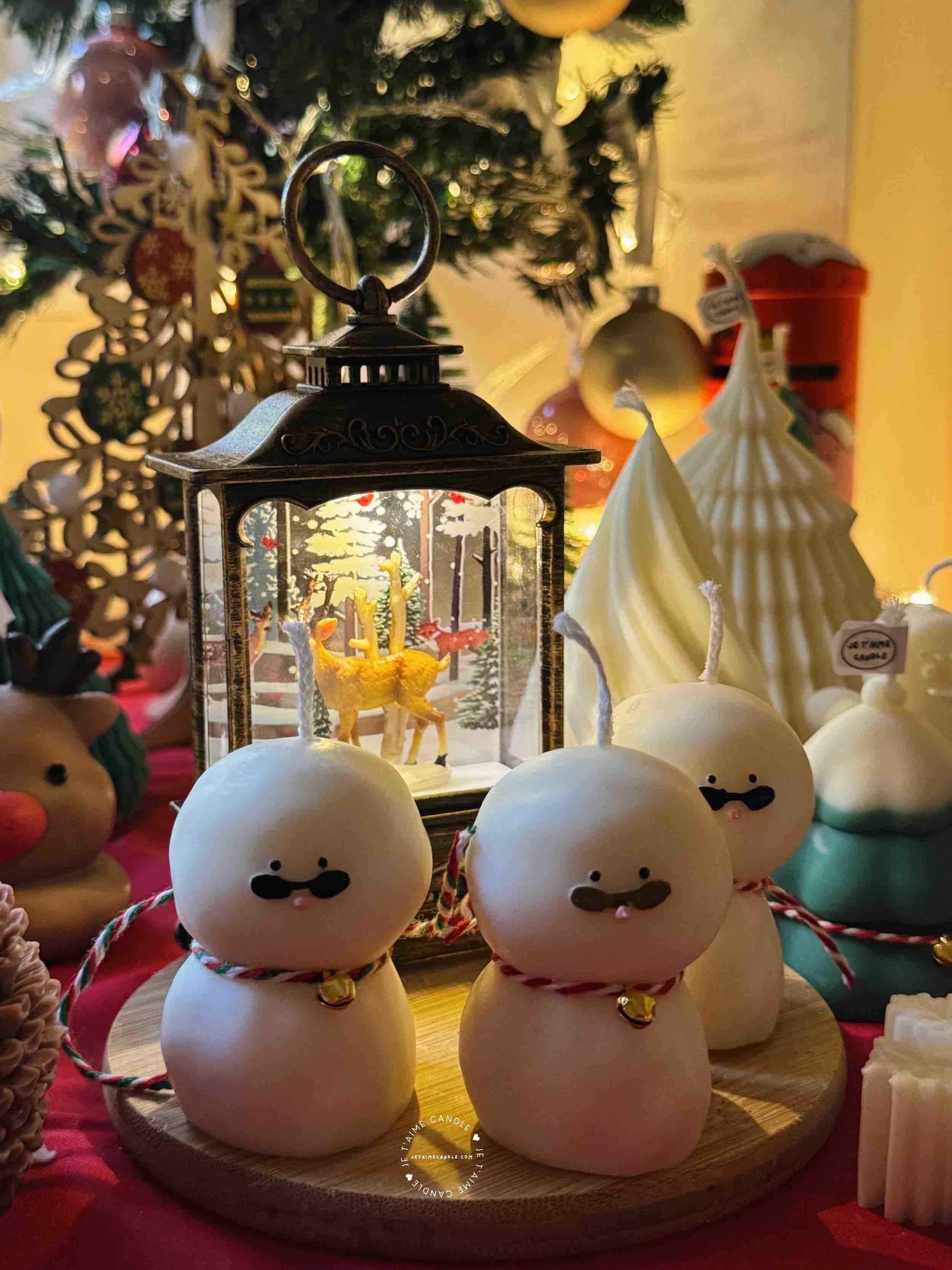 An adorable handmade snowman candles, perfect for Christmas decor or holiday gifts. Each candle features a snowman with a cute sunglasses and a holiday bell, crafted from high-quality wax for a clean burn. The charming design adds warmth and festive cheer to any room, ideal for winter themes or cozy home decor.
