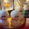 An adorable handmade snowman candles, perfect for Christmas decor or holiday gifts. Each candle features a snowman with a cute sunglasses and a holiday bell, crafted from high-quality wax for a clean burn. The charming design adds warmth and festive cheer to any room, ideal for winter themes or cozy home decor.
