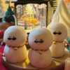 An adorable handmade snowman candles, perfect for Christmas decor or holiday gifts. Each candle features a snowman with a cute sunglasses and a holiday bell, crafted from high-quality wax for a clean burn. The charming design adds warmth and festive cheer to any room, ideal for winter themes or cozy home decor.
