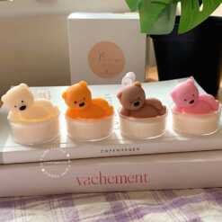 Adorable bear-shaped tealight candles in assorted colors placed on a cozy table setup, perfect for adding charm to home decor, gifting, or creating a warm ambiance.