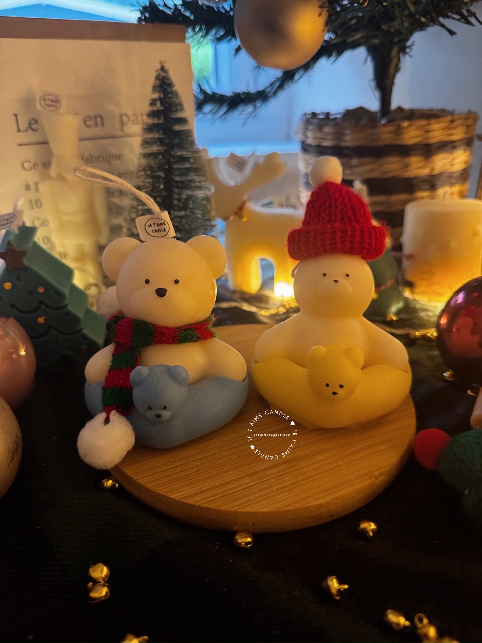 Two adorable teddy bears and bunny on a wooden tray, surrounded by festive Christmas decorations, radiating holiday cheer.