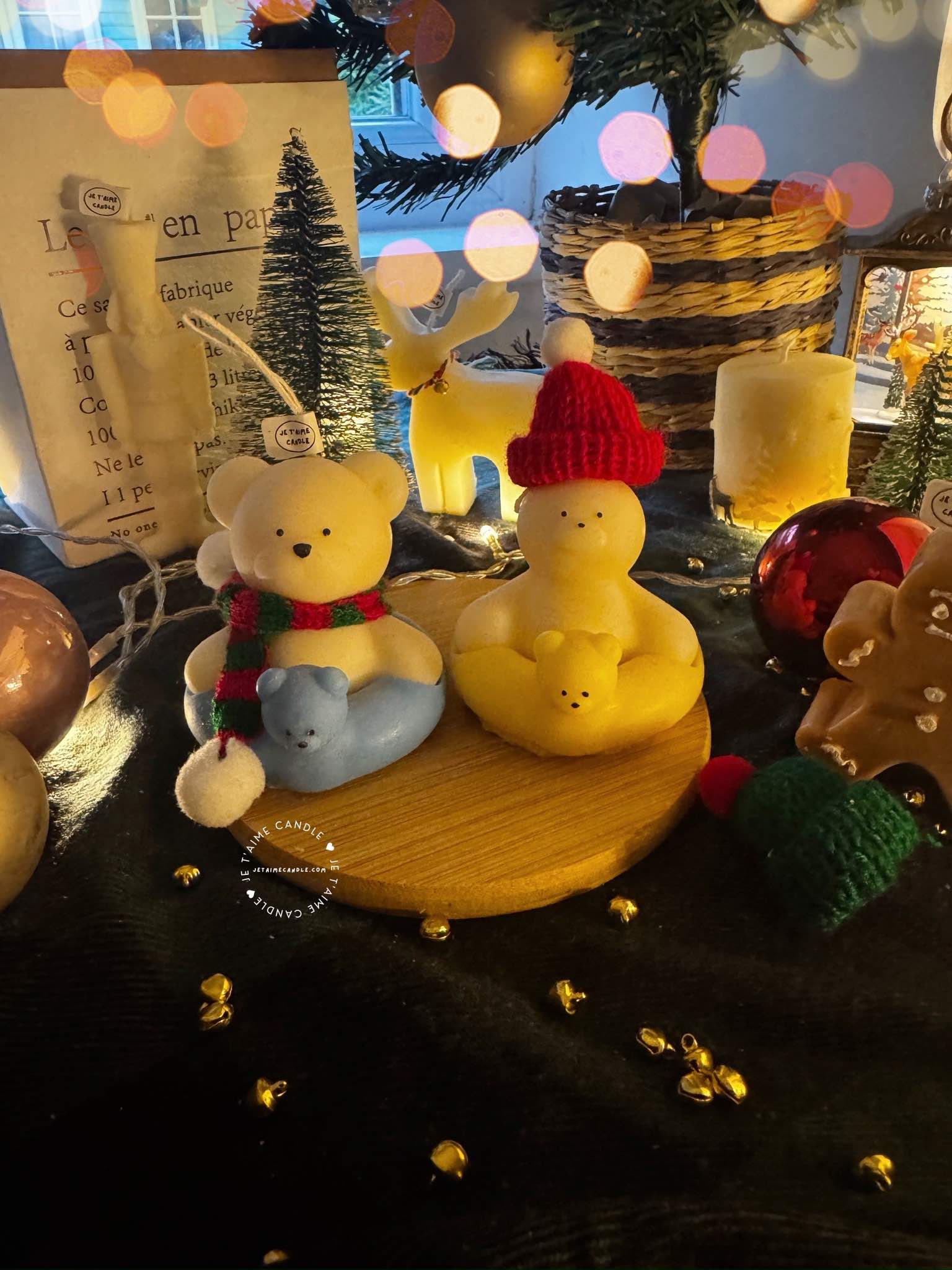 Two adorable teddy bears and bunny on a wooden tray, surrounded by festive Christmas decorations, radiating holiday cheer.