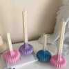 These are beautifully designed decorative candles with a unique aesthetic. The candles have an ombre effect that fades from a vibrant color at the bottom (pink, purple, and blue) to a creamy white at the top.