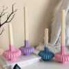 These are beautifully designed decorative candles with a unique aesthetic. The candles have an ombre effect that fades from a vibrant color at the bottom (pink, purple, and blue) to a creamy white at the top.