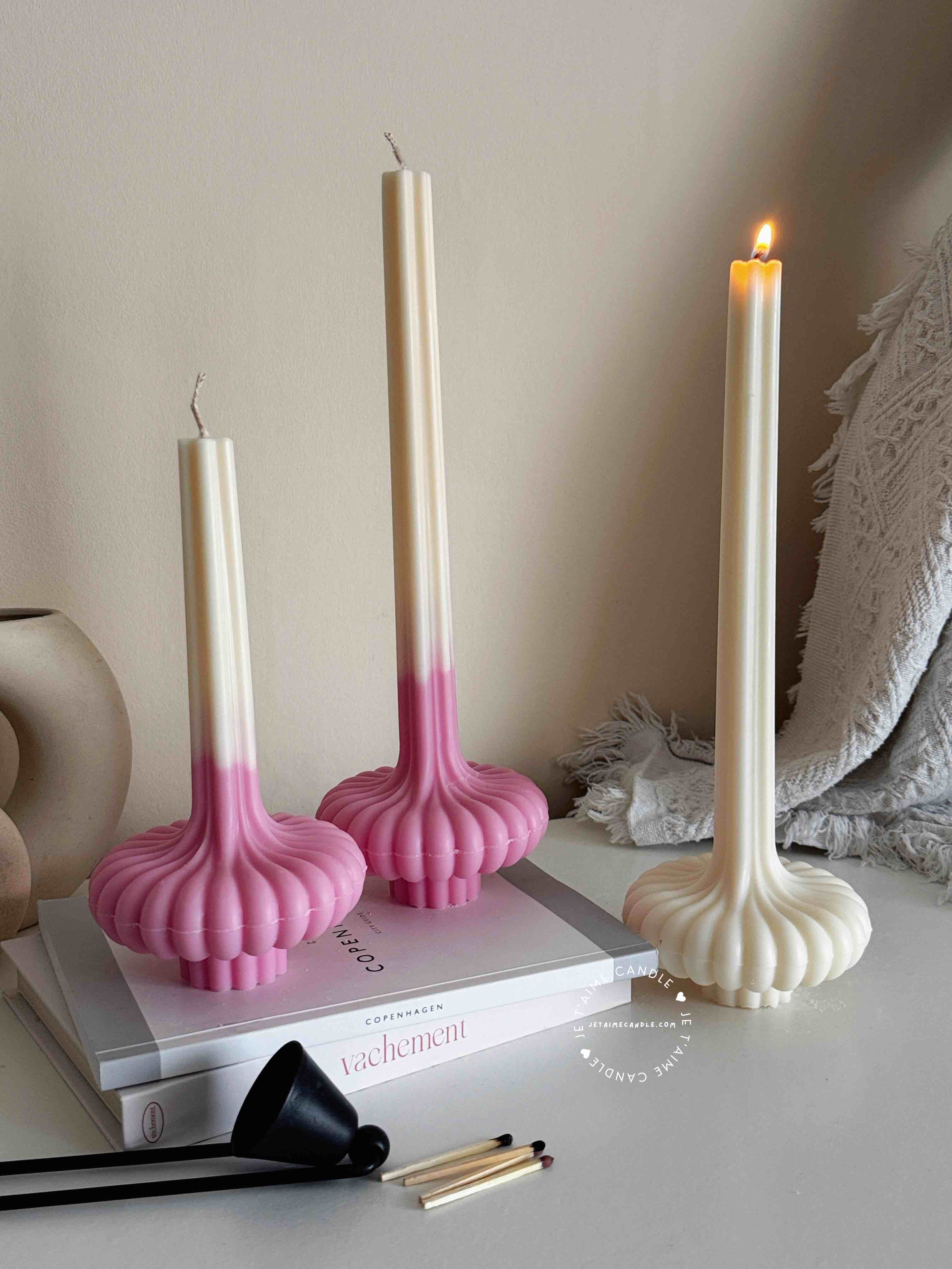 These are beautifully designed decorative candles with a unique aesthetic. The candles have an ombre effect that fades from a vibrant color at the bottom (pink, purple, and blue) to a creamy white at the top.