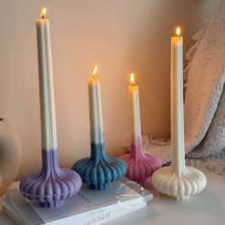 These are beautifully designed decorative candles with a unique aesthetic. The candles have an ombre effect that fades from a vibrant color at the bottom (pink, purple, and blue) to a creamy white at the top.