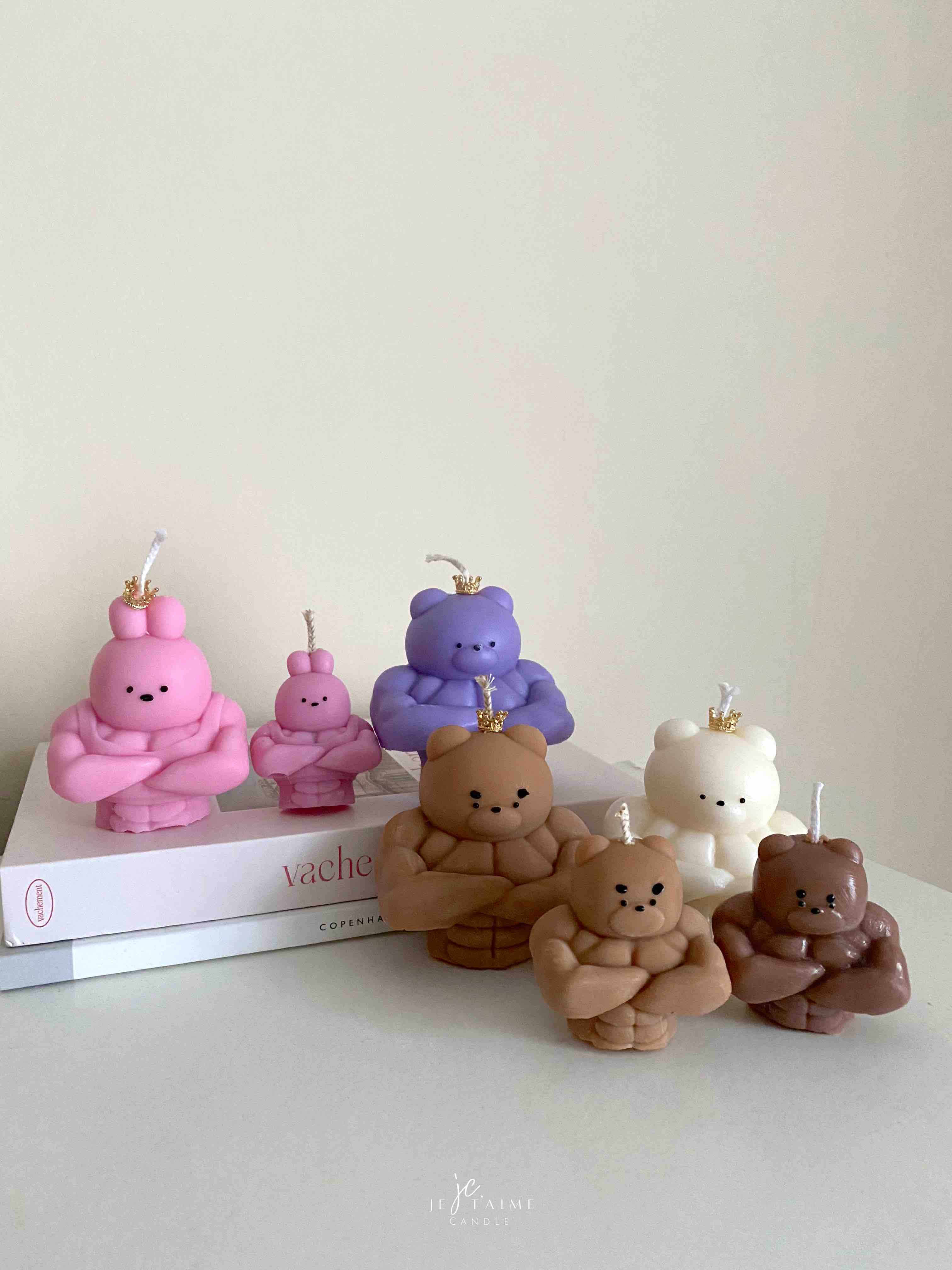 A delightful mix of small, colorful candles, showcasing the unique Buff Bear Candle, great for gifts and adding warmth to any space.