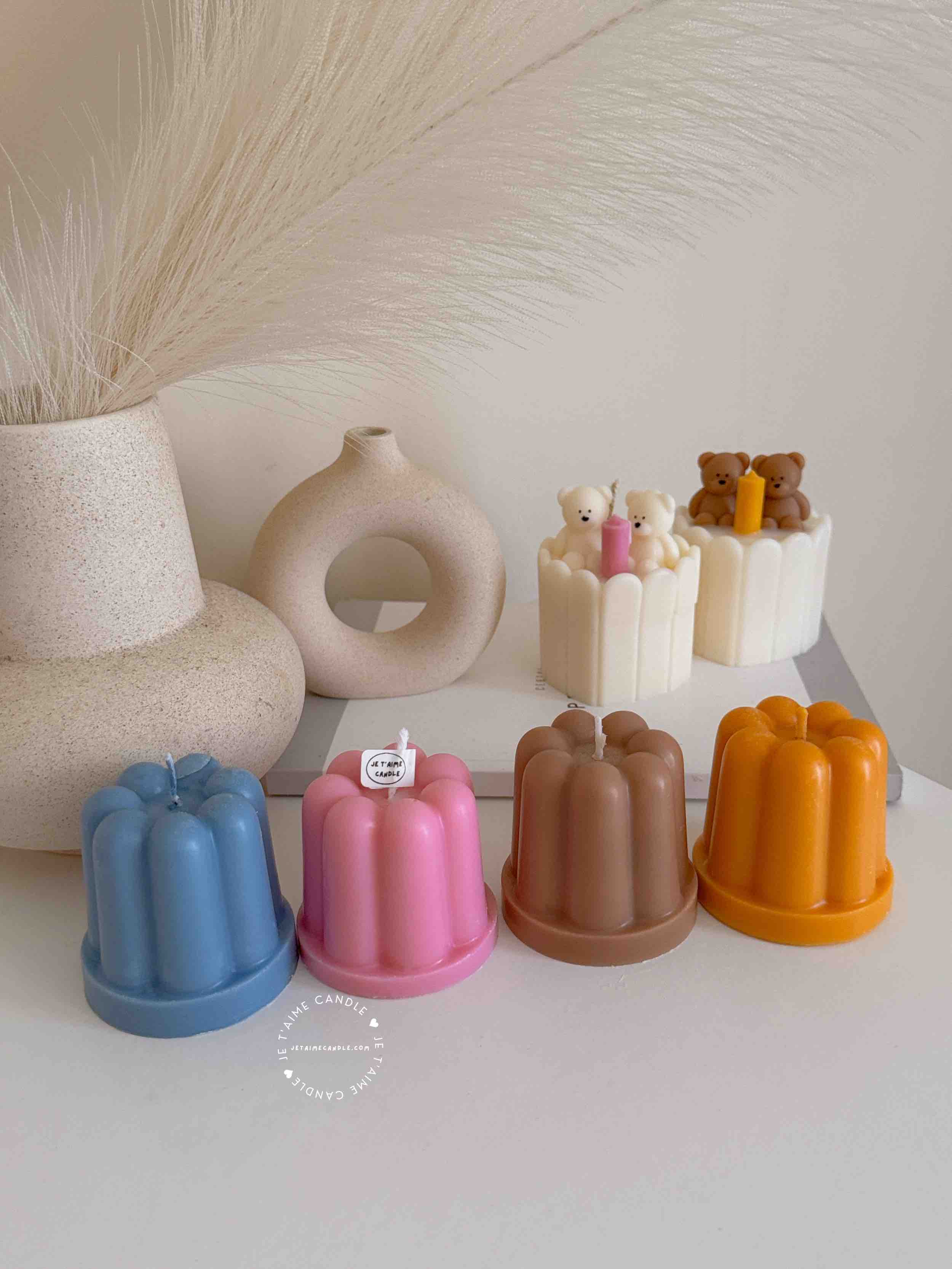 An assortment of small cakes arranged on a table, perfect for sharing sweet moments and special occasions.