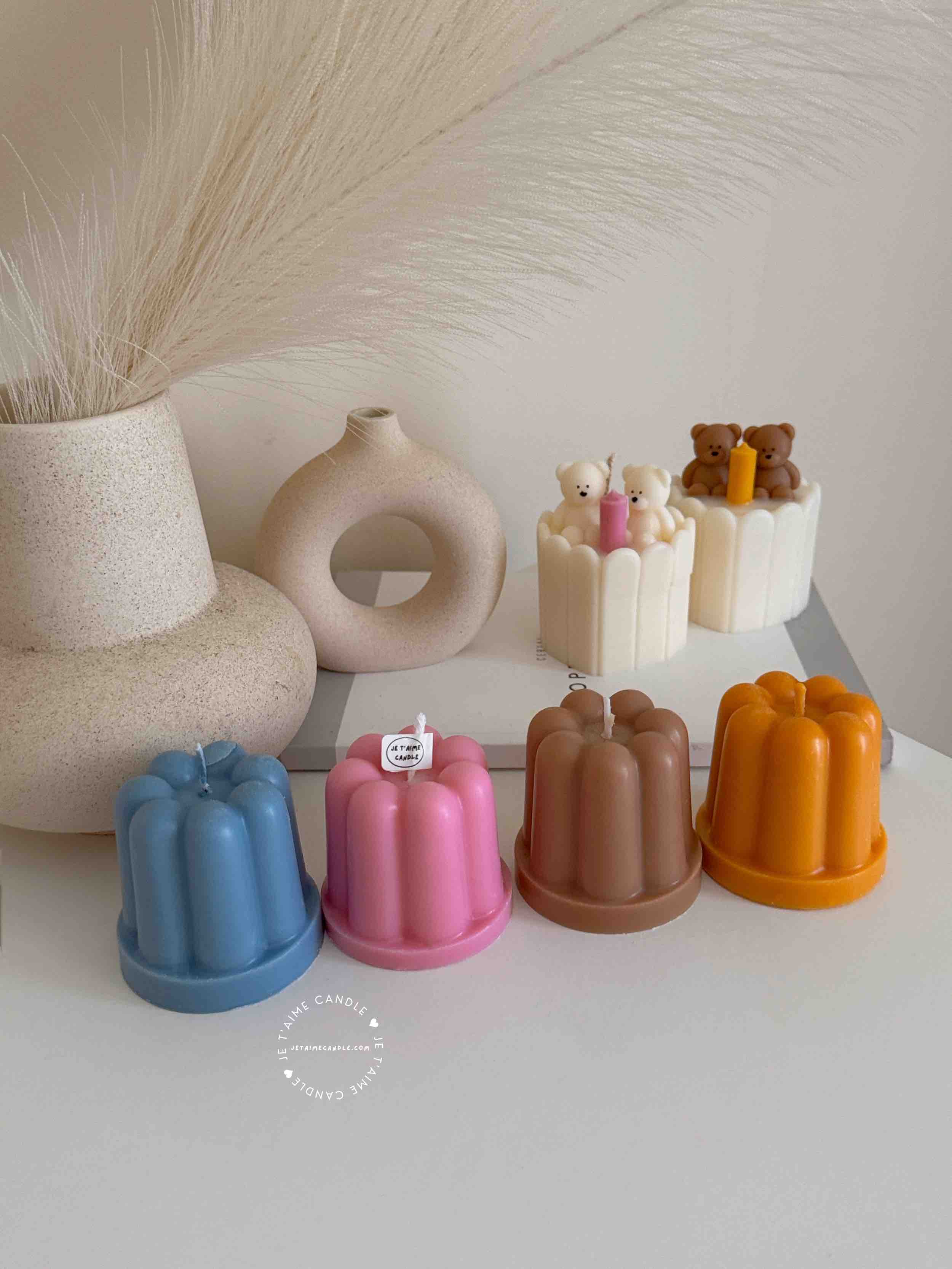 An assortment of small cakes arranged on a table, perfect for sharing sweet moments and special occasions.
