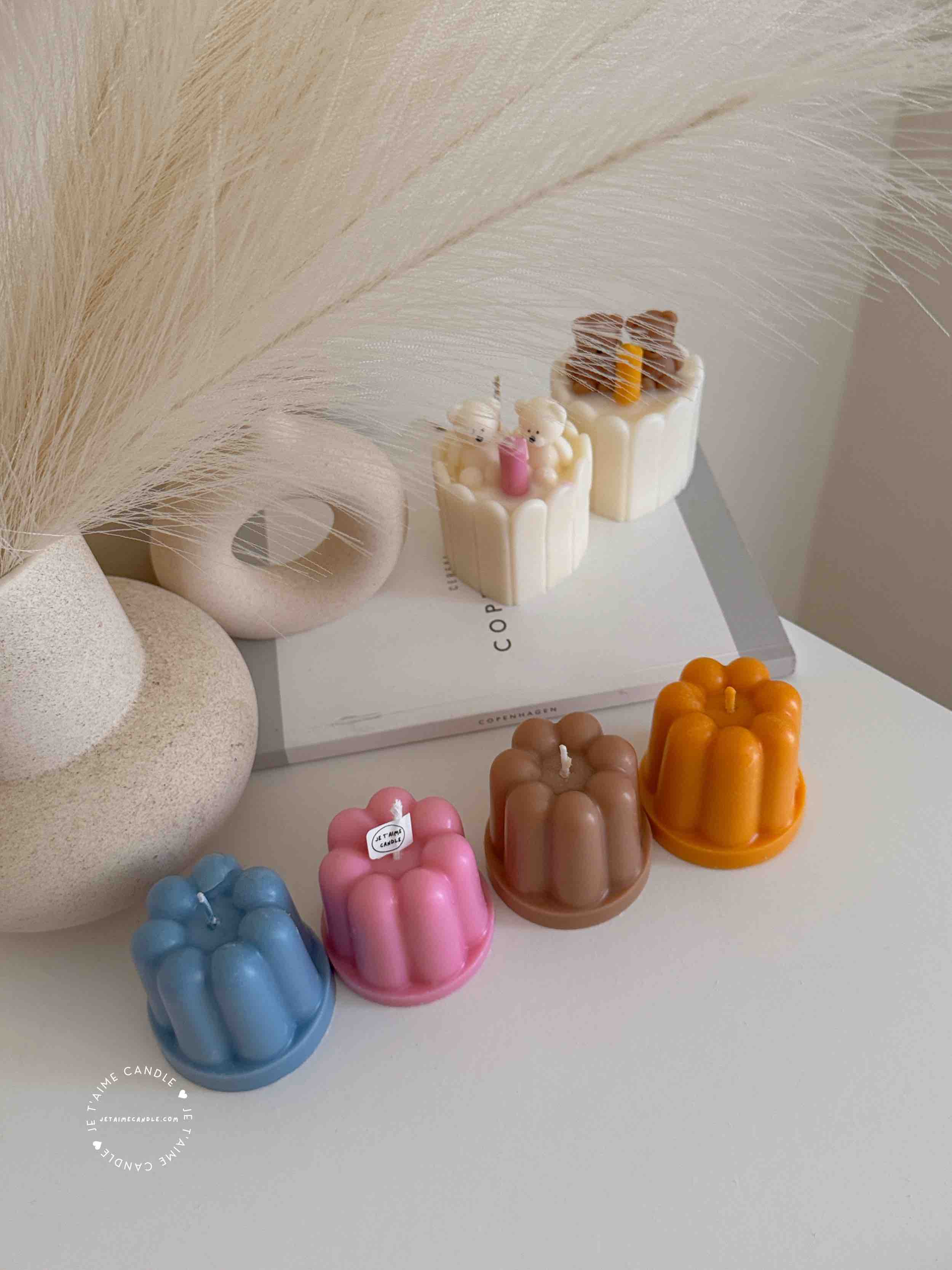 An assortment of small cakes arranged on a table, perfect for sharing sweet moments and special occasions.
