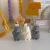 Adorable mouse figurines gathered on a table, perfect for bringing a playful vibe to your decor.
