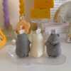 Adorable mouse figurines gathered on a table, perfect for bringing a playful vibe to your decor.