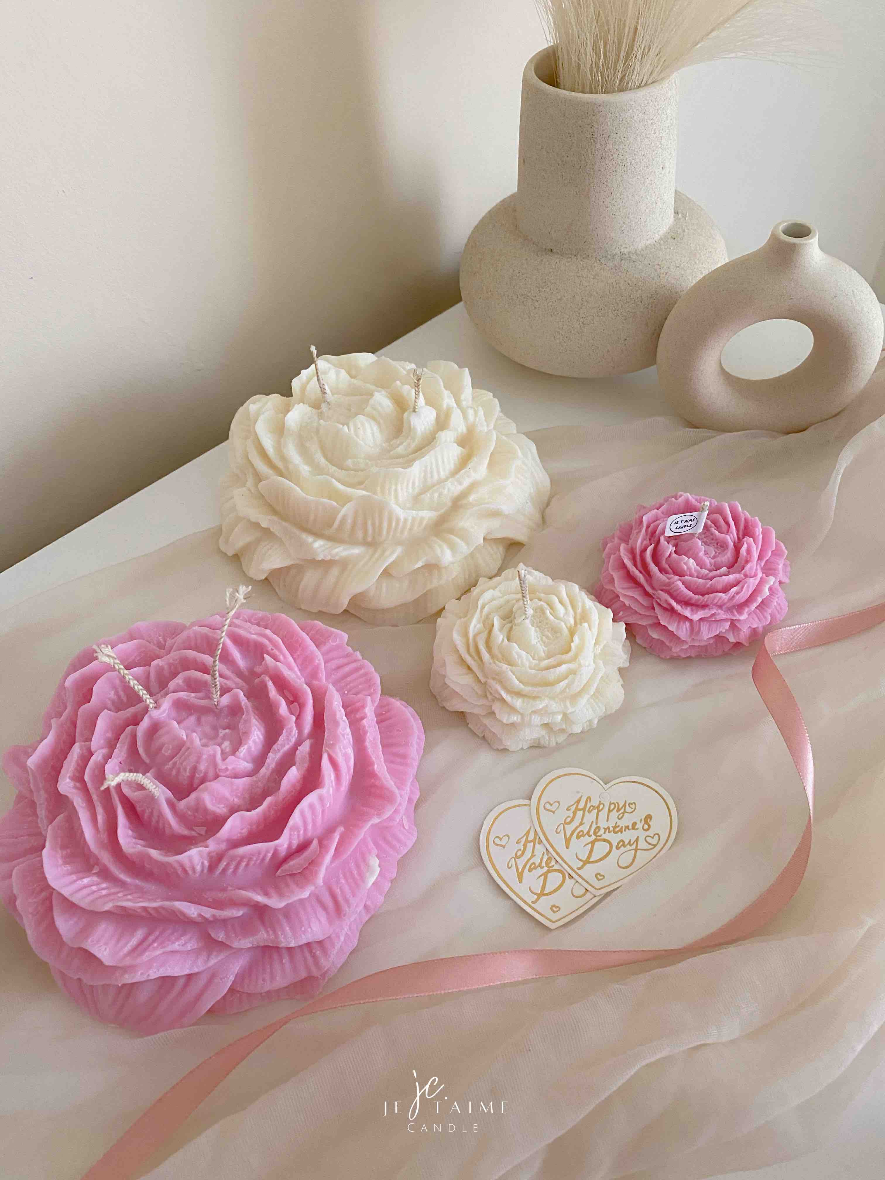 A table adorned with pink and white roses, creating a serene and elegant atmosphere for any occasion.