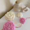 A table adorned with pink and white roses, creating a serene and elegant atmosphere for any occasion.