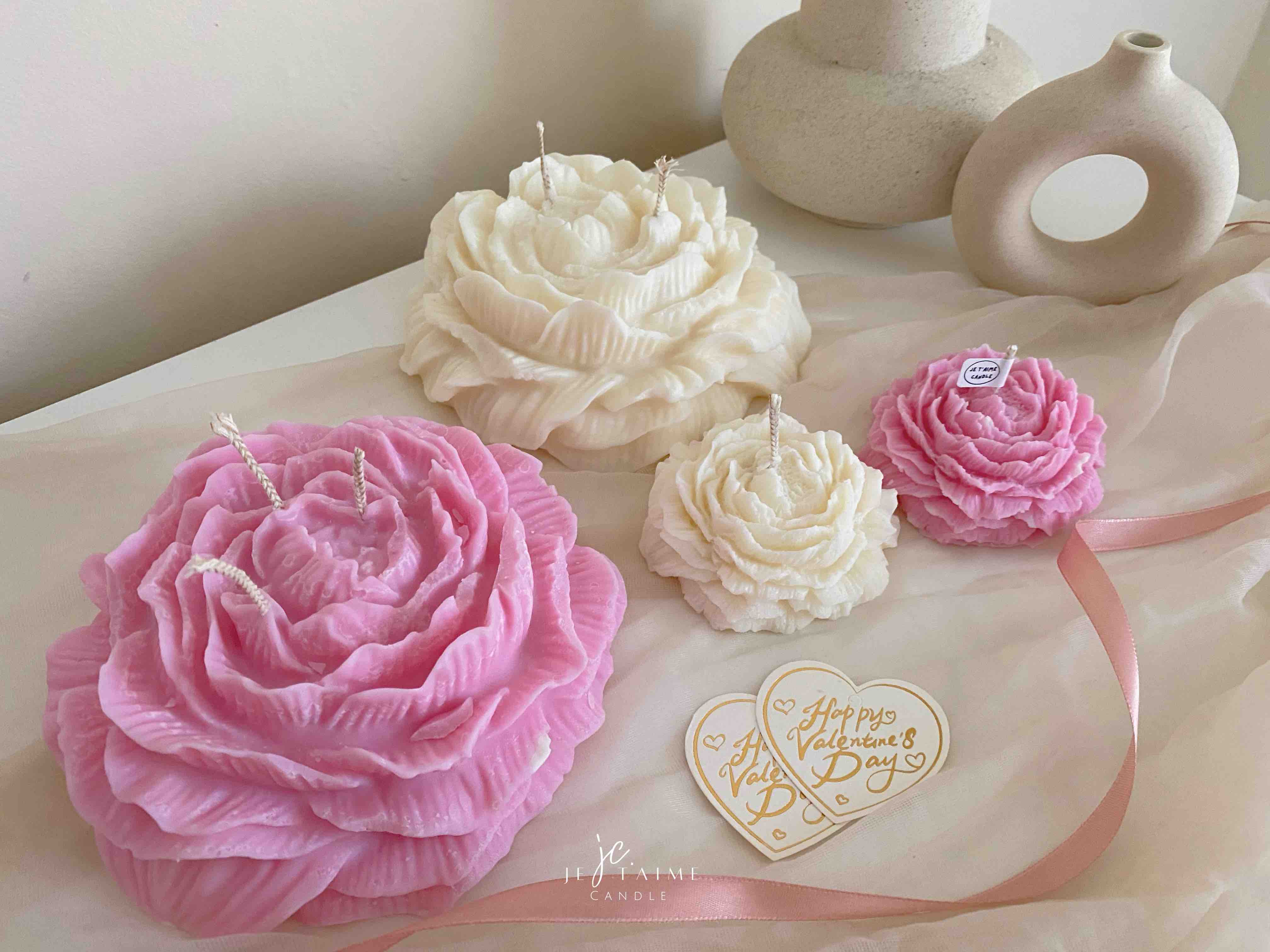 A table adorned with pink and white roses, creating a serene and elegant atmosphere for any occasion.
