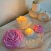 A table adorned with pink and white roses, creating a serene and elegant atmosphere for any occasion.