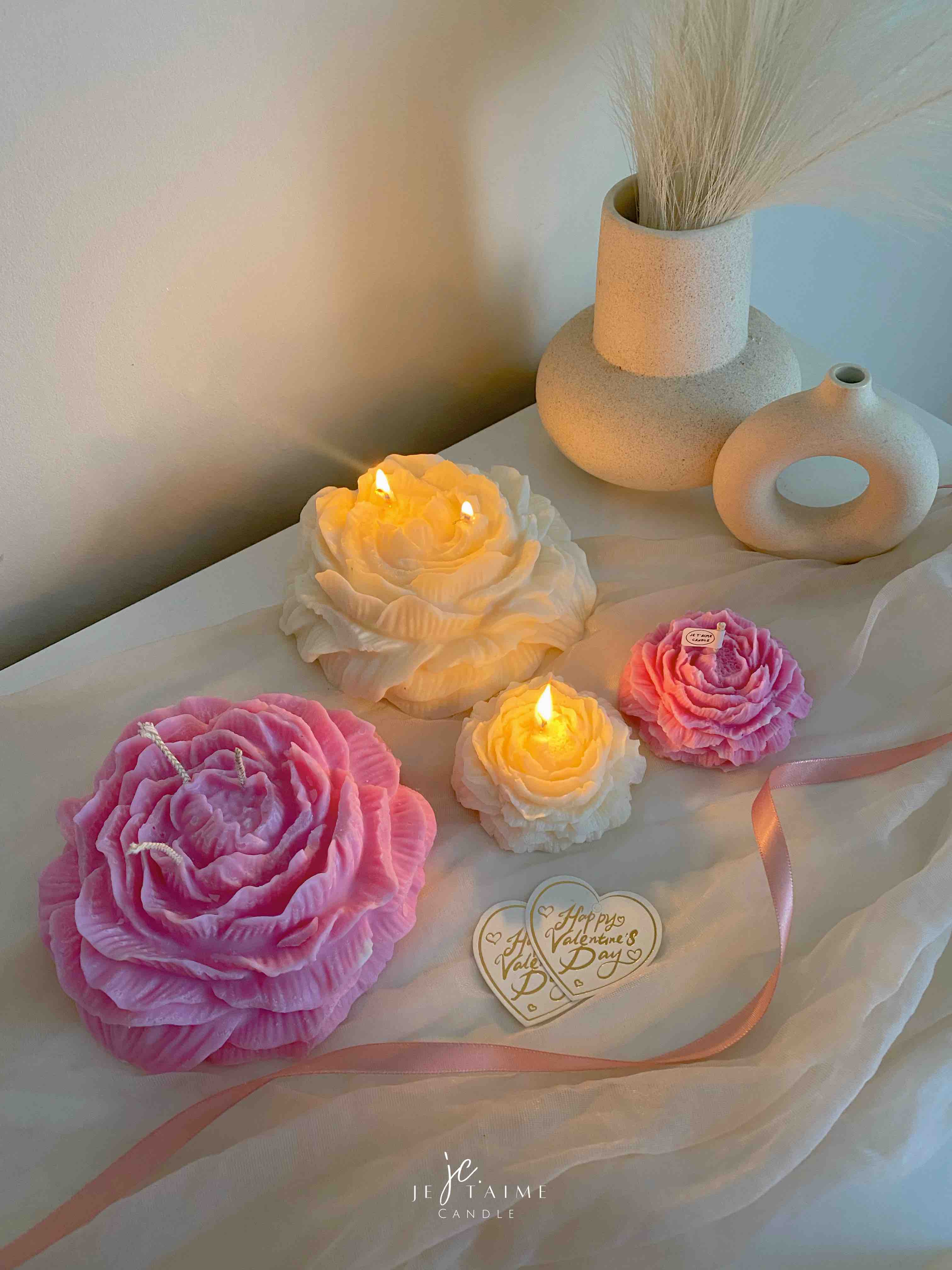 A table adorned with pink and white roses, creating a serene and elegant atmosphere for any occasion.