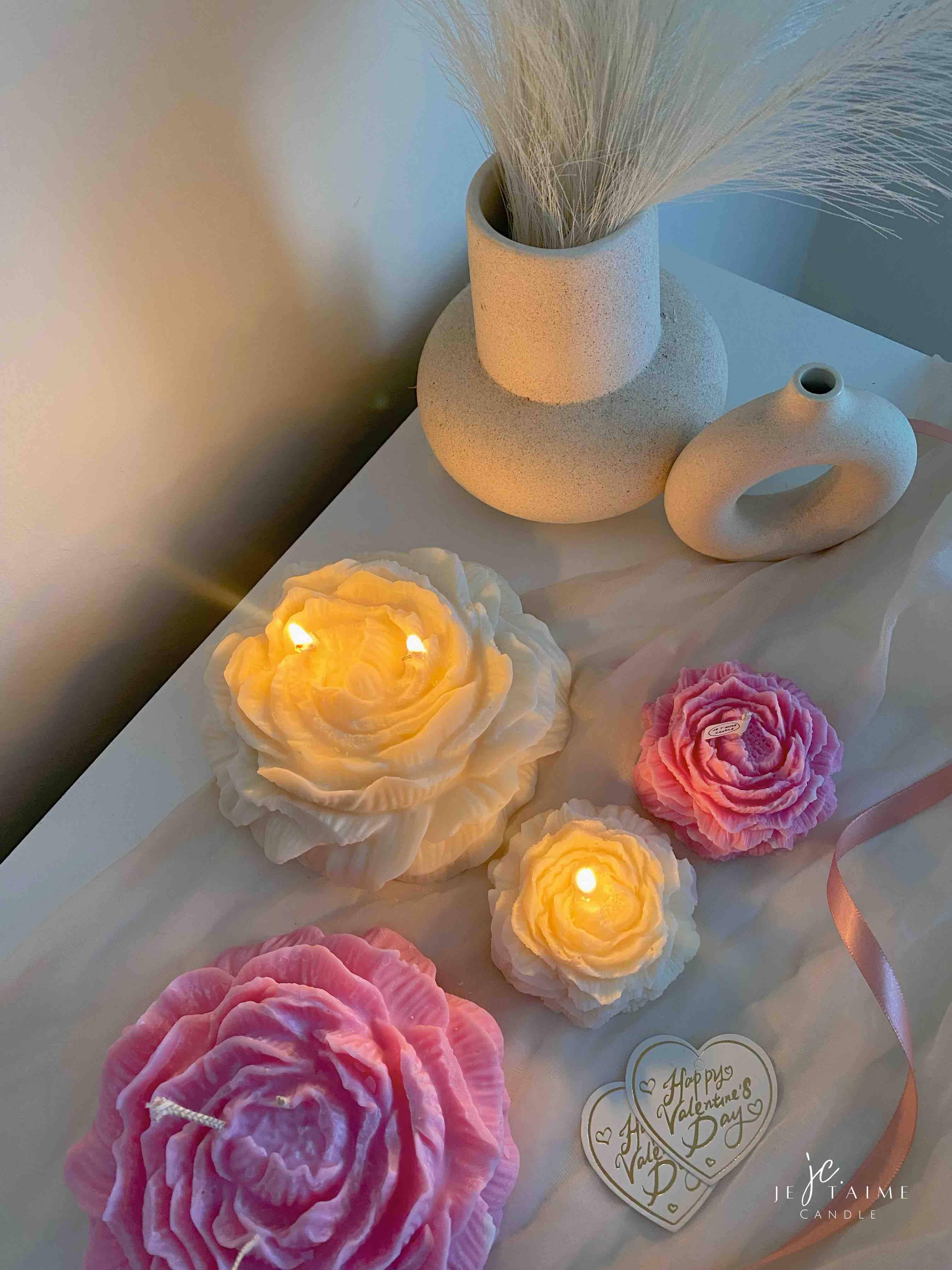 A table adorned with pink and white roses, creating a serene and elegant atmosphere for any occasion.