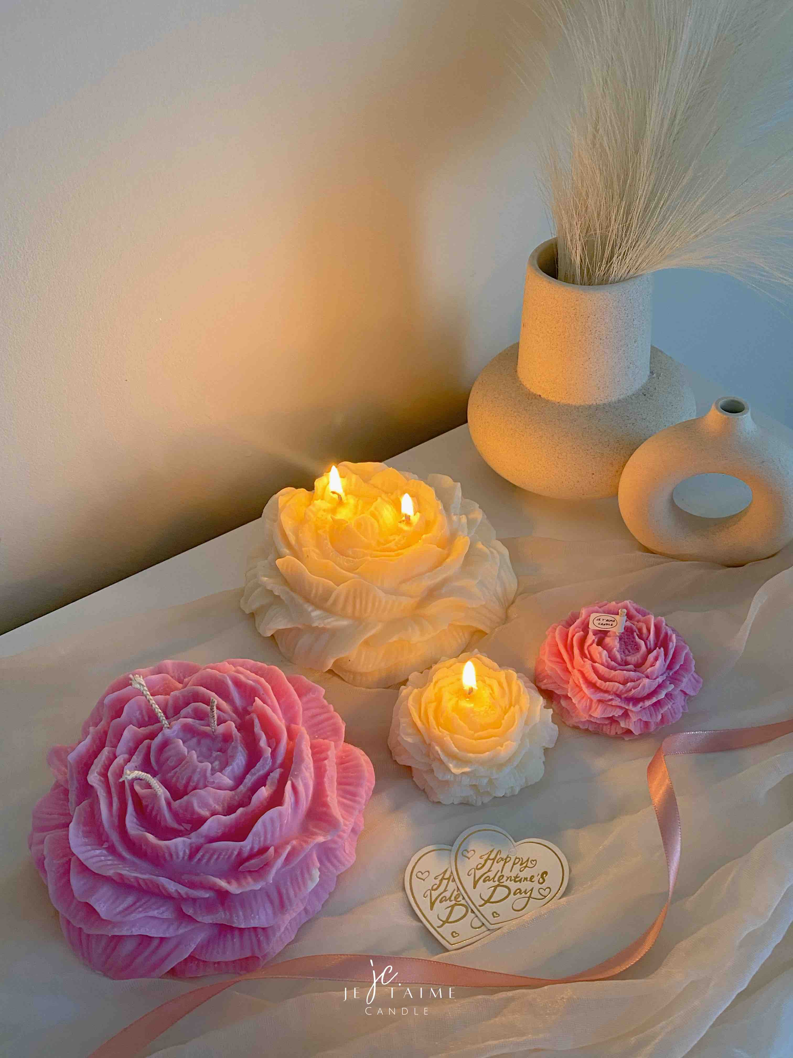 A table adorned with pink and white roses, creating a serene and elegant atmosphere for any occasion.