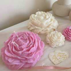A table adorned with pink and white roses, creating a serene and elegant atmosphere for any occasion.