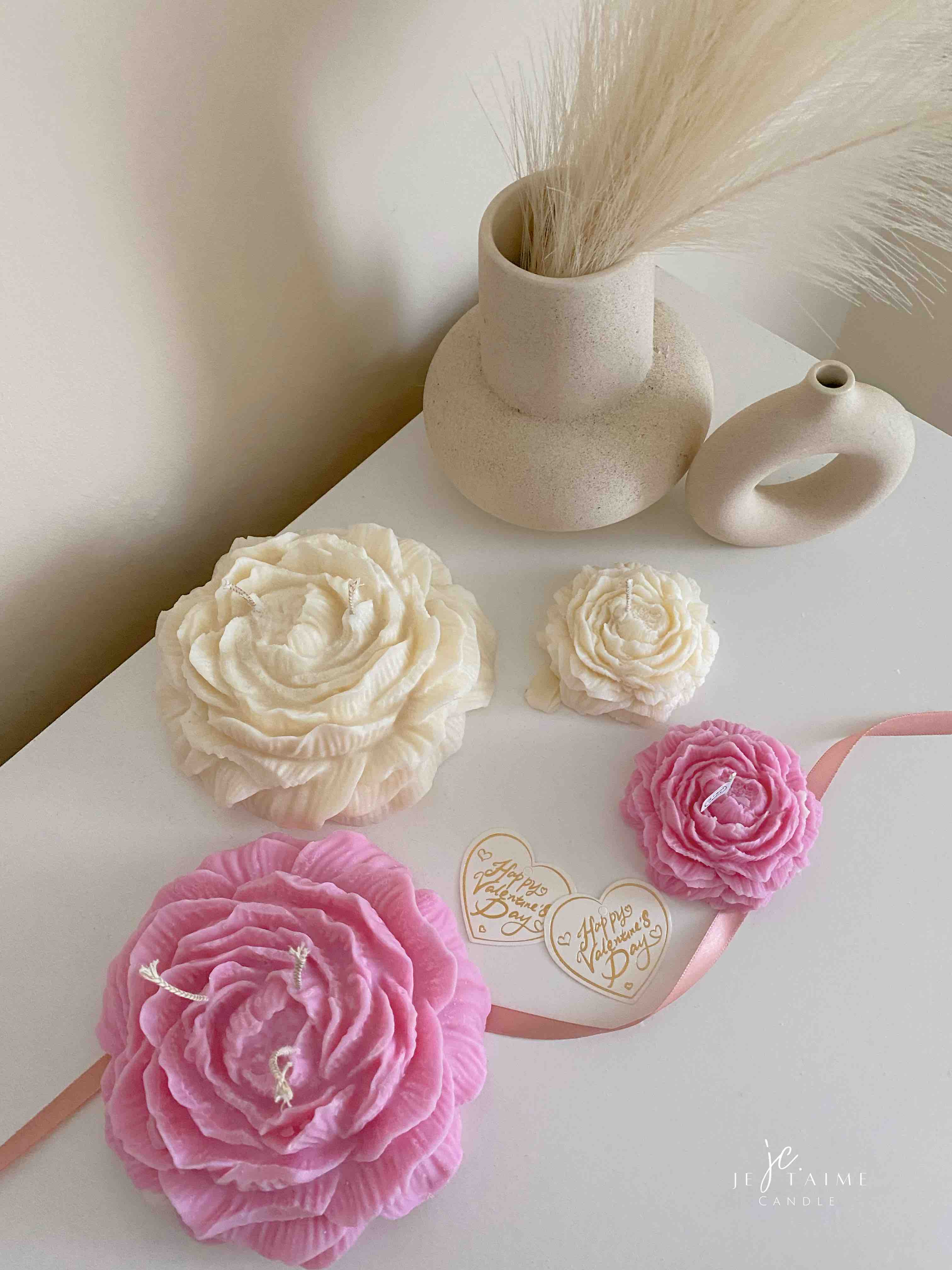 A table adorned with pink and white roses, creating a serene and elegant atmosphere for any occasion.