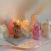 Three beautifully designed candles in white, pink and brown, perfect for a romantic gift or anniversary celebration.