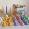 A collection of chubby duck-shaped candles on a table, perfect for duck lovers and quirky home decor enthusiasts.