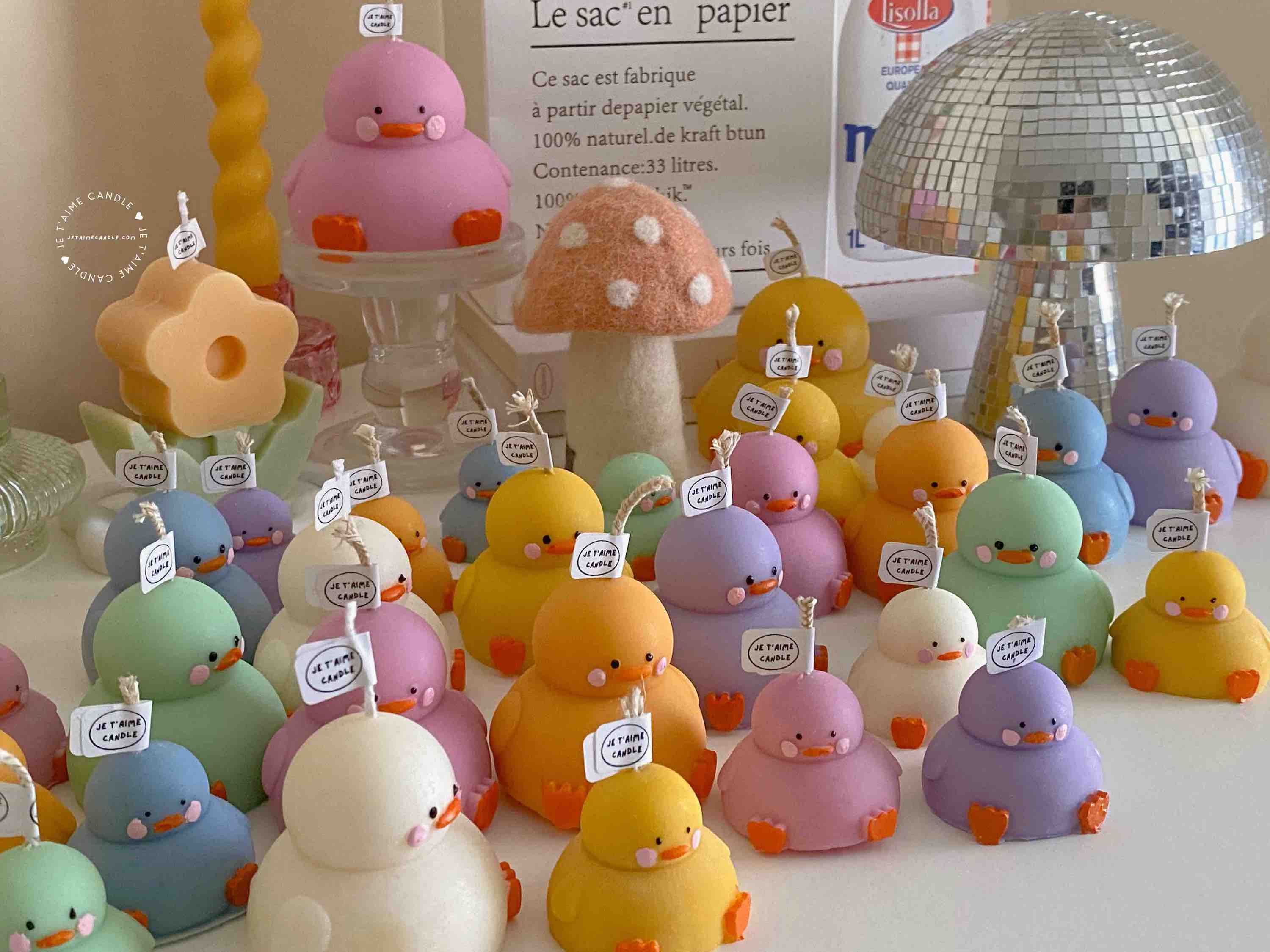 A collection of chubby duck-shaped candles on a table, perfect for duck lovers and quirky home decor enthusiasts.