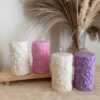 Four beautifully designed candles with floral and intricate patterns, adding elegance and warmth to any space.
